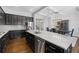 Modern kitchen with stainless steel appliances, granite countertops, and a view into the dining area at 5504 Cameron Parc Dr, Alpharetta, GA 30022