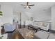 Bright living room with hardwood floors, neutral colors and elegant decor creating a sophisticated ambiance at 5504 Cameron Parc Dr, Alpharetta, GA 30022