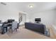 Spacious living room offering a dedicated office space, modern furniture, and staircase at 5504 Cameron Parc Dr, Alpharetta, GA 30022