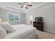 Bright main bedroom featuring a cozy bed, a view from the window, and tasteful decor at 5504 Cameron Parc Dr, Alpharetta, GA 30022