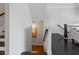 Staircase leading to a lower level with dark wood flooring and white walls at 5504 Cameron Parc Dr, Alpharetta, GA 30022