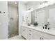This stylish bathroom features double sinks with matte black fixtures and a glass enclosed shower at 704 Banton Nw Dr, Atlanta, GA 30318