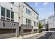 The exterior of these townhomes are multi-story with garage doors and dark brick bases at 704 Banton Nw Dr, Atlanta, GA 30318