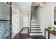 Modern hallway with dark hardwood floors, staircase, and stylish decor at 704 Banton Nw Dr, Atlanta, GA 30318