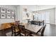 Well-appointed kitchen and dining area with modern cabinets, island, and hardwood floors at 704 Banton Nw Dr, Atlanta, GA 30318