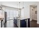 Well-lit kitchen featuring stainless steel appliances and a blue island at 704 Banton Nw Dr, Atlanta, GA 30318