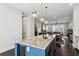 Open kitchen featuring a large island with pendant lighting and stainless steel appliances at 704 Banton Nw Dr, Atlanta, GA 30318