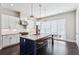 Modern kitchen with island, stainless steel appliances, and dark hardwood floors at 704 Banton Nw Dr, Atlanta, GA 30318