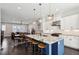 Open concept kitchen with large island, stainless steel appliances, and modern pendant lighting at 704 Banton Nw Dr, Atlanta, GA 30318