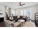 Bright living room with fan, dark flooring, and lots of seating at 704 Banton Nw Dr, Atlanta, GA 30318