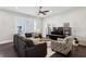 Bright living room offering neutral walls, dark flooring, and entertainment center at 704 Banton Nw Dr, Atlanta, GA 30318
