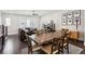 Open floorplan with living and dining areas featuring dark hardwood flooring at 704 Banton Nw Dr, Atlanta, GA 30318