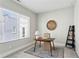 This office has a large window for natural light, and a simple desk and chair at 704 Banton Nw Dr, Atlanta, GA 30318