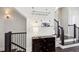 Staircase with dark banister and dark cabinet for storing wine at 704 Banton Nw Dr, Atlanta, GA 30318