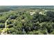 Overhead view showing a beautiful wooded area and a golf course at 9025 Huntcliff Trce, Atlanta, GA 30350