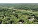 Breathtaking aerial view of lush woodlands surrounding a tranquil river at 9025 Huntcliff Trce, Atlanta, GA 30350