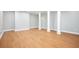 Unfinished basement with light wood floor and neutral colored walls is ready for customization at 9025 Huntcliff Trce, Atlanta, GA 30350