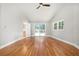 Spacious bedroom with hardwood floors, ceiling fan, and sliding door to outdoor deck at 9025 Huntcliff Trce, Atlanta, GA 30350