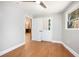 Cozy bedroom with laminate floors and natural light, next to walk-in closet at 9025 Huntcliff Trce, Atlanta, GA 30350