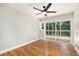 Bedroom with hardwood floors and a sliding glass door leading to a deck at 9025 Huntcliff Trce, Atlanta, GA 30350