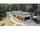 Charming exterior displaying meticulous landscaping and a private drive at 9025 Huntcliff Trce, Atlanta, GA 30350