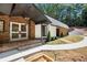 Inviting covered entrance with stone accents at 9025 Huntcliff Trce, Atlanta, GA 30350