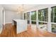 Bright and airy kitchen featuring a large island, quartz countertops, and view of backyard at 9025 Huntcliff Trce, Atlanta, GA 30350