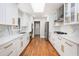 Updated kitchen with modern cabinets, quartz countertops, and stainless steel appliances at 9025 Huntcliff Trce, Atlanta, GA 30350