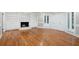 Spacious living room featuring fireplace and hardwood floors at 9025 Huntcliff Trce, Atlanta, GA 30350