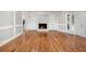 Spacious living room featuring fireplace and hardwood floors at 9025 Huntcliff Trce, Atlanta, GA 30350
