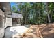 Inviting back patio with stone walkway bordering the residence at 9025 Huntcliff Trce, Atlanta, GA 30350