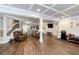 Finished basement area with hardwood-style floors, coffered ceilings, and recessed lighting at 998 Poplar Mill Ct, Buford, GA 30518