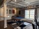 Spacious finished basement featuring a pool table, coffered ceiling, and ample room for activities at 998 Poplar Mill Ct, Buford, GA 30518