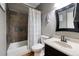Bathroom featuring a vanity with sink, toilet, tub and shower, and modern accents at 998 Poplar Mill Ct, Buford, GA 30518