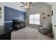 Cozy bedroom features natural light, neutral tones, and decor at 998 Poplar Mill Ct, Buford, GA 30518