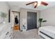 This bedroom with neutral tones and a ceiling fan overlooks backyard at 998 Poplar Mill Ct, Buford, GA 30518