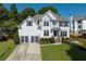 Charming two-story home with a well-maintained lawn and two-car garage in a residential neighborhood at 998 Poplar Mill Ct, Buford, GA 30518