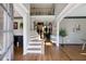 Spacious foyer with hardwood floors, staircase, and views into the dining and living areas at 998 Poplar Mill Ct, Buford, GA 30518