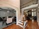 Open layout showing stairs, dining room, and living room with a fireplace at 998 Poplar Mill Ct, Buford, GA 30518