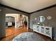 Open foyer showing hardwood floors, a staircase, and an archway into the dining room at 998 Poplar Mill Ct, Buford, GA 30518
