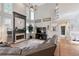 Bright and airy living room features high ceilings, fireplace, and large windows at 998 Poplar Mill Ct, Buford, GA 30518