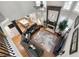 Living room and kitchen with open floor plan, high ceilings, fireplace, and modern decor at 998 Poplar Mill Ct, Buford, GA 30518