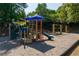 A playground with a blue slide, various climbing structures, and two swingsets at 998 Poplar Mill Ct, Buford, GA 30518
