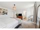 Light-filled bedroom features modern decor, carpeted flooring, and a woven pendant light at 1001 Starmoss Ln, Conyers, GA 30094
