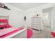 Cozy bedroom with carpet flooring and a pink accent rug at 1001 Starmoss Ln, Conyers, GA 30094