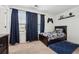 Bedroom with a blue accent rug and curtains, plus fun game-themed accents at 1001 Starmoss Ln, Conyers, GA 30094