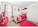 room with bright pink accents, carpet flooring, and lots of natural light at 1001 Starmoss Ln, Conyers, GA 30094