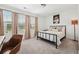 Cozy bedroom features natural light, neutral tones, and comfortable carpet at 1001 Starmoss Ln, Conyers, GA 30094