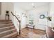 Bright entryway with stairs, hardwood floors, a window, and stylish accents at 1001 Starmoss Ln, Conyers, GA 30094
