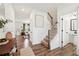 Welcoming entryway with hardwood floors, staircase, and stylish decor at 1001 Starmoss Ln, Conyers, GA 30094